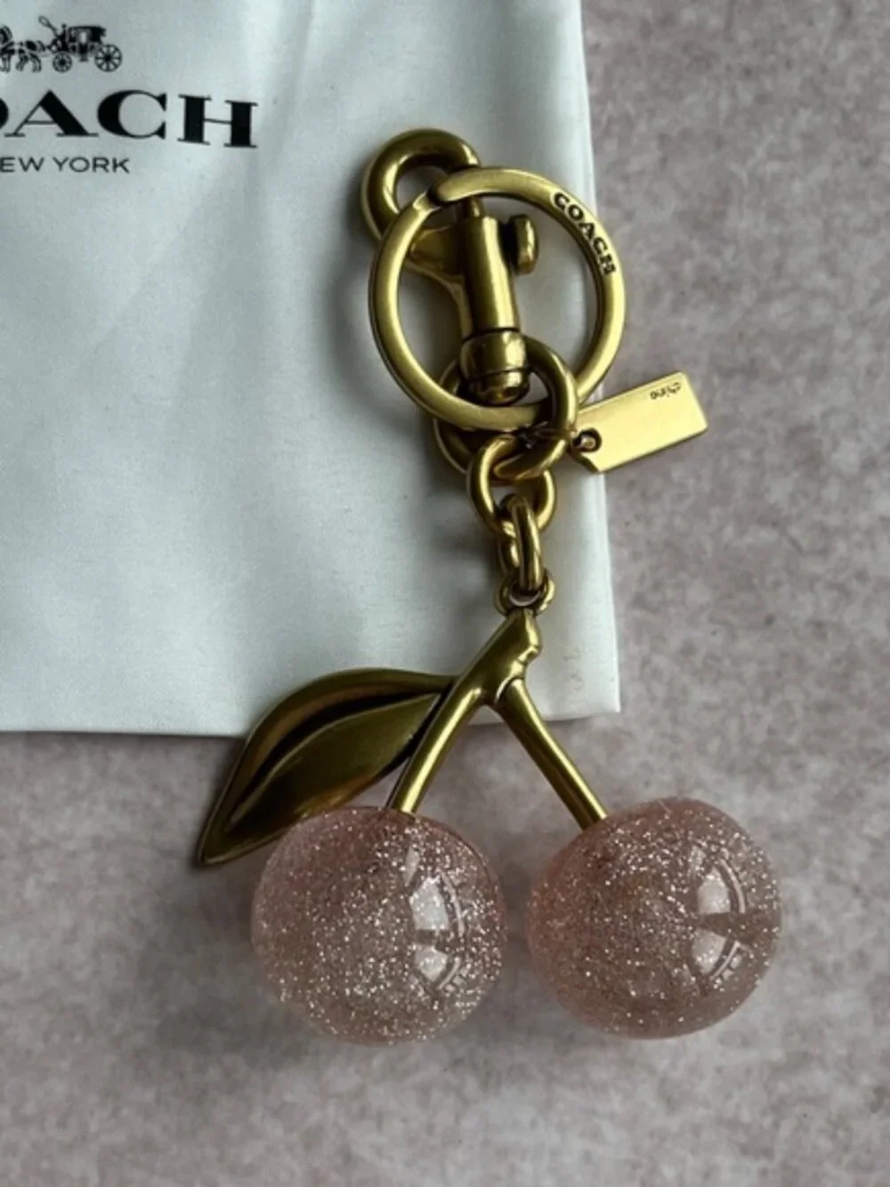 COACH Pink Glitter Cherry Bag Charm with Gold Hardware